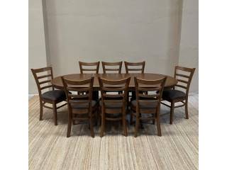 Mesa extensible madera maciza de gomero, oval con doble pedestal reforzado   8 sillas con asientos tapizados en microfibra antique color chocolate. Medidas Cerrado: 180x74 cms. Medidas Extendido: 210x74 cms. 